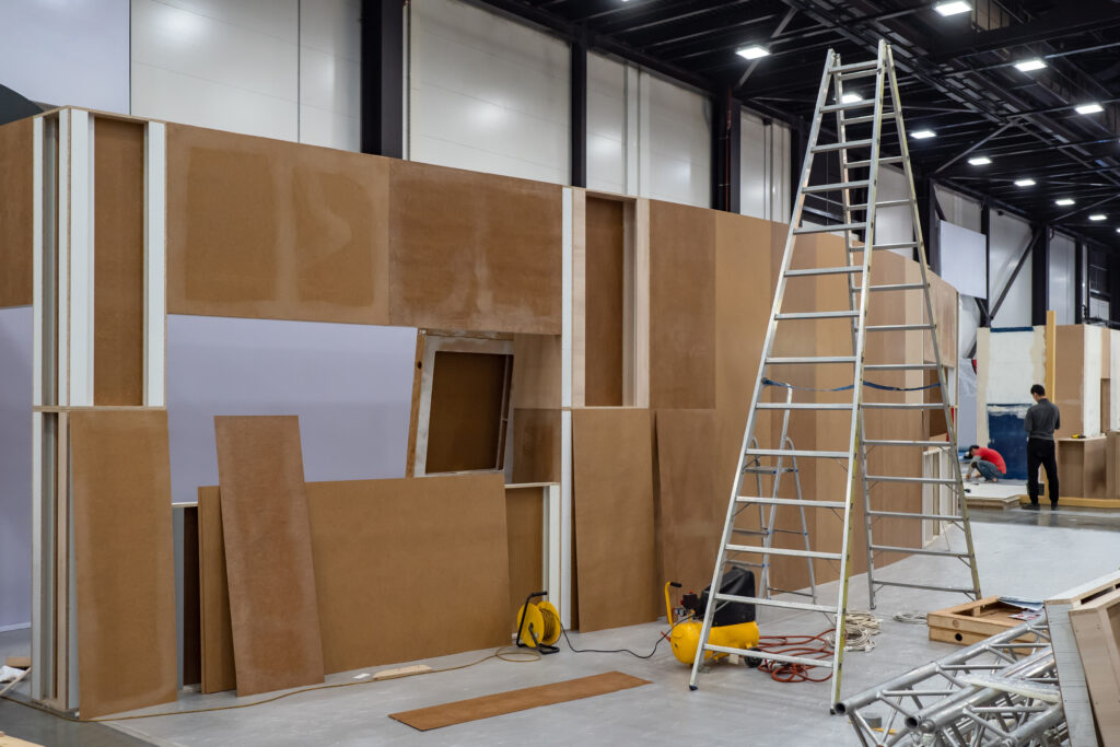 A ladder and some construction materials in a room.