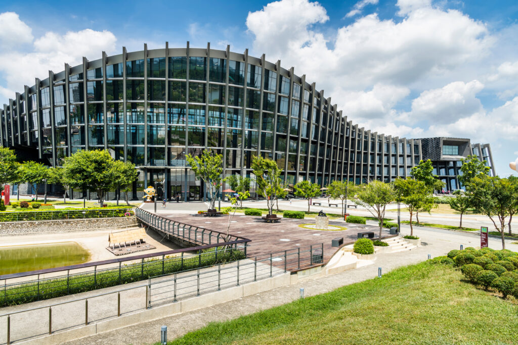 A large building with many windows and trees