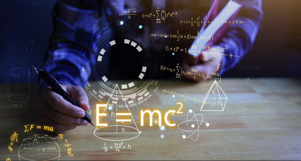 A person writing on a table with some equations